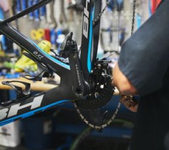 a man servicing e-bike